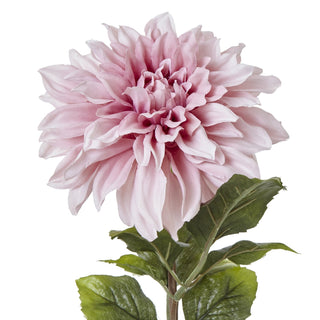 Detailed close-up of the artificial pink dahlia flower and upper stem with green foliage.