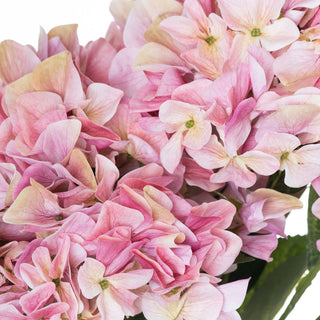 Close-up detail of the artificial pink hydrangea florets showing veining and subtle colour gradients.