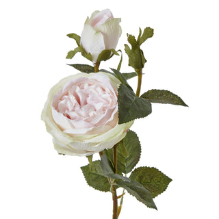 Close-up detail of the artificial pale pink rose bloom and bud, showing petal texture and green leaves.