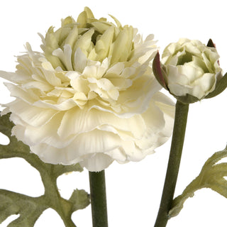 Artificial ranunculus close-up: creamy white bloom with pale green centre, closed bud, and textured green leaf.