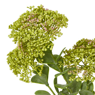 Close detail of the artificial sedum spray's dense light green flower clusters and rounded leaves.