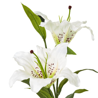 Two open white artificial lily blooms with reddish-brown speckles on the petals.