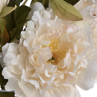 Close detail of the artificial peony bloom showing the yellow centre and fabric petal texture.