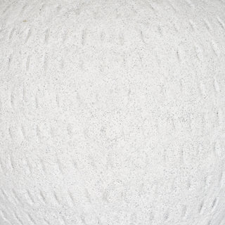 Extreme close-up of the vase body showing the rough, granular white surface and rows of indented dash marks.