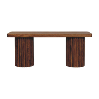 Plain front-on product shot of the dark wood bench with fluted cylindrical supports.