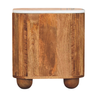 Smooth wooden back panel of the bedside cabinet with white marble top and rounded bun feet.