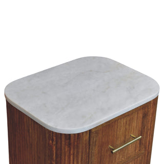 Detail shot of the smooth, rounded white marble surface contrasting with the textured brown wood grain below.