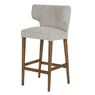 Full view of the Avia barstool upholstered in textured mist fabric on wooden legs.