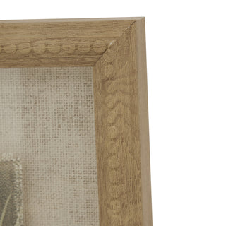 Detail shot of the beaded wooden frame corner joint and the coarse weave of the linen mount.