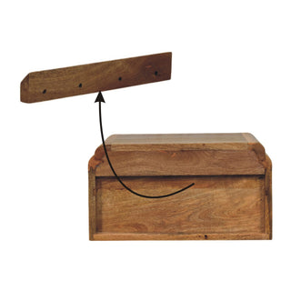 Exploded view showing the wall mounting bracket and the rear of the bedside unit.