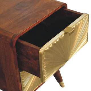 Close-up of the chestnut nightstand with the top drawer open, revealing the dark wood interior and brass sunburst front.