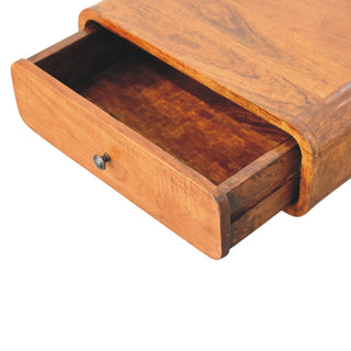 Detail shot of the nightstand with the single drawer fully extended, revealing the dark wood interior.