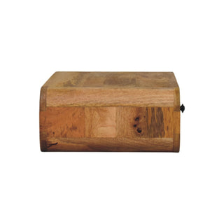 Side view of the nightstand showing its depth, rounded front edge, and patchwork wood grain.