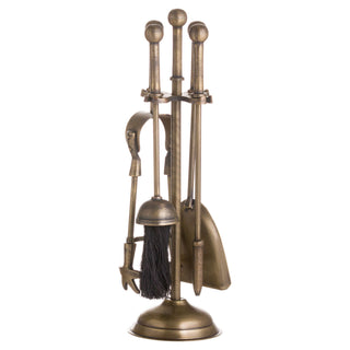 Antique brass fireplace companion set with four tools and ball-topped handles, shown front-on.