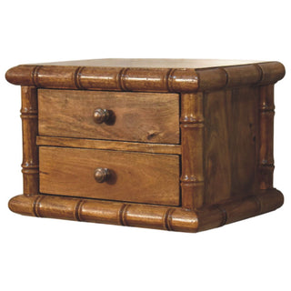 Amber oak bedside unit viewed from a slight angle, showing the depth and the bamboo-effect frame detail.