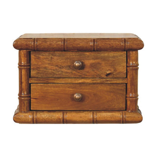 Plain front-on shot of the amber oak bedside table with two drawers and bamboo-effect frame.