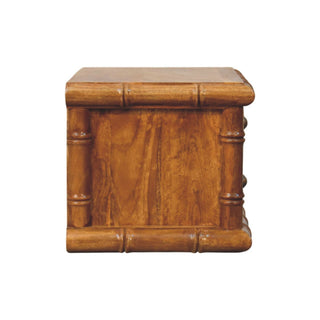 Side view of the amber oak bedside unit, showing the solid panel and bamboo-effect frame.