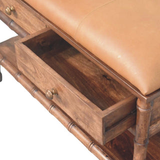 Open storage drawer detail on the dark wood bench, showing the interior grain and the tan leather seat above.