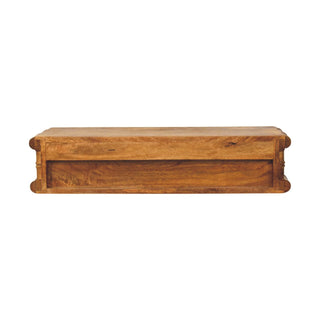 View from below showing the bottom surface of the console and the carved bamboo moulding on the ends.