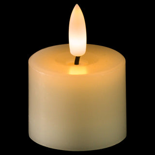 Single LED tea light candle lit up against a black background, showing the warm glow and bright flame.