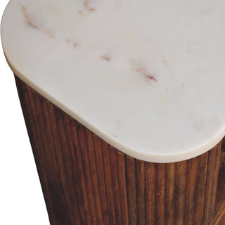 Close up of the white marble top surface showing pink and brown veining details.