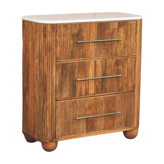 Three-quarter view of the chest showing the warm wood grain texture and rounded bun feet.