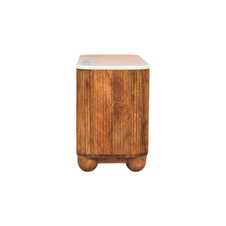 Profile view showing the fluted wooden side panel, white marble top, and two wooden ball feet.