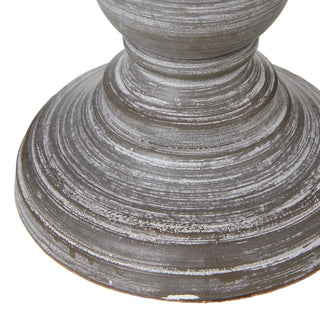 Extreme close-up of the turned foot of the grey wood lamp base, showing the concentric rings and heavily distressed paintwork.