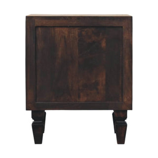 Back of the dark wood nightstand with a solid recessed panel and turned, tapered rear legs.