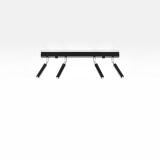 Black four-spotlight ceiling fixture mounted flush against a white ceiling, viewed from below.