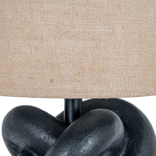 Texture detail of the black knot lamp base and the woven natural hessian shade.