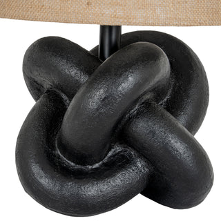 Close up showing the interlocking loops and textured finish of the black knot lamp base.
