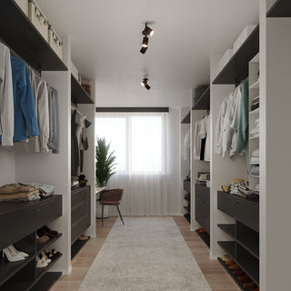Styled scene showing two black cylindrical spotlights installed on the ceiling of a walk-in wardrobe.