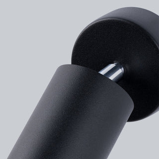 Close view of the adjustable joint connecting the black cylindrical lamp body to the circular mounting base.