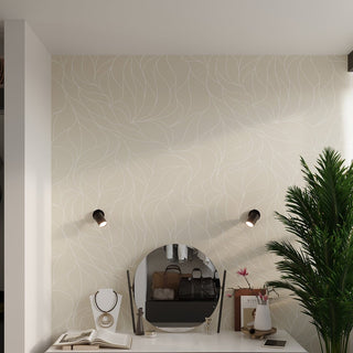 Two black wall spotlights installed above a dressing table with a mirror and patterned wallpaper.