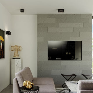 Pair of black cube ceiling lights and a coordinating wall light in a modern living space.