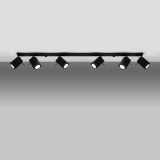 Front view of the black track light fixture with six illuminated cylindrical spot lamps.