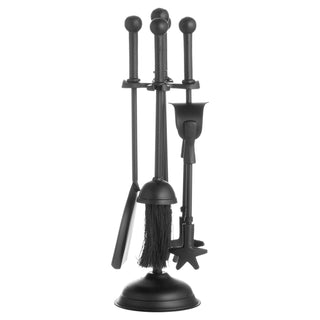 Four black metal fireplace tools, including a brush and shovel, hanging neatly on the central stand.