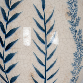 Detail of the crackle glaze ceramic surface showing the blue vertical leaf pattern.