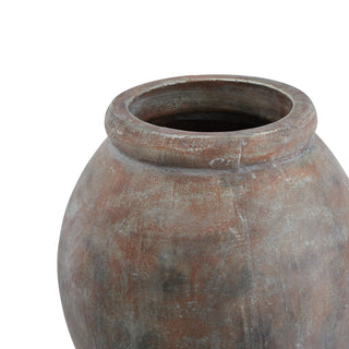 Upper section of the ceramic planter showing the rounded rim and weathered texture.