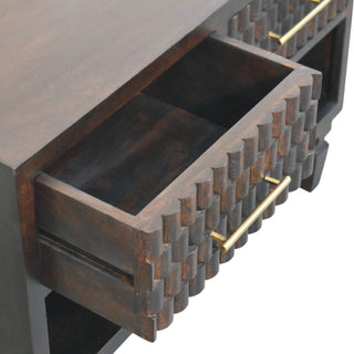 Open drawer detail showing the dark wood interior and the construction of the carved front.