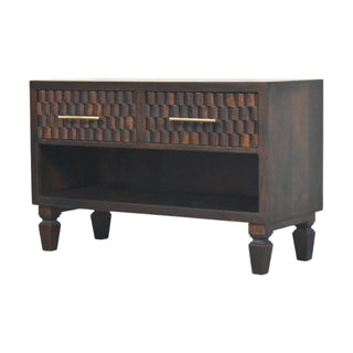 Plain studio shot of the dark wood storage bench showing turned feet and carved drawer fronts.