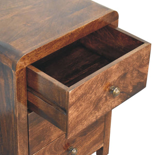 Close-up of the dark walnut bedside cabinet with the top drawer pulled open, showing the internal wood finish.