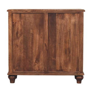 Rear view of the dark wood chest showing the panelled back construction and turned feet.