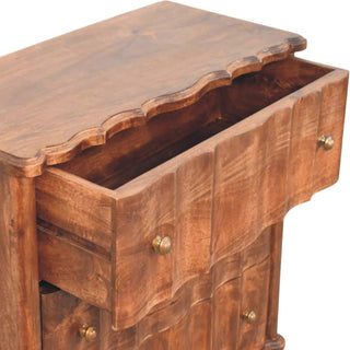 Dark wood chest with the top drawer open, showing the internal construction and the fluted, curved drawer front.