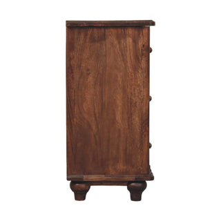 Full side profile of the dark wood chest showing the deep grain and turned bun feet.