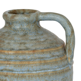 Close detail of the vase body showing the rough, mottled blue-grey glaze and horizontal tan bands.