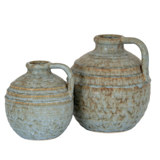 Two krater jug vases, one large and one small, with mottled blue-grey glaze and ribbed ceramic texture.