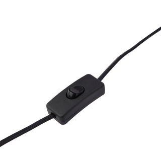 Close-up of the black plastic inline rocker switch on the table lamp's electrical flex.