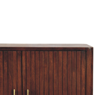 Detail shot showing the rounded top edge and the vertical fluting texture of the cabinet doors.